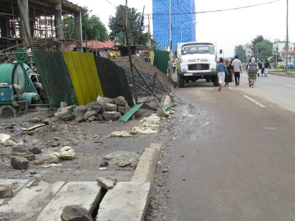 Pedestrians walking in the carriageway where the footpath is blocked by construction