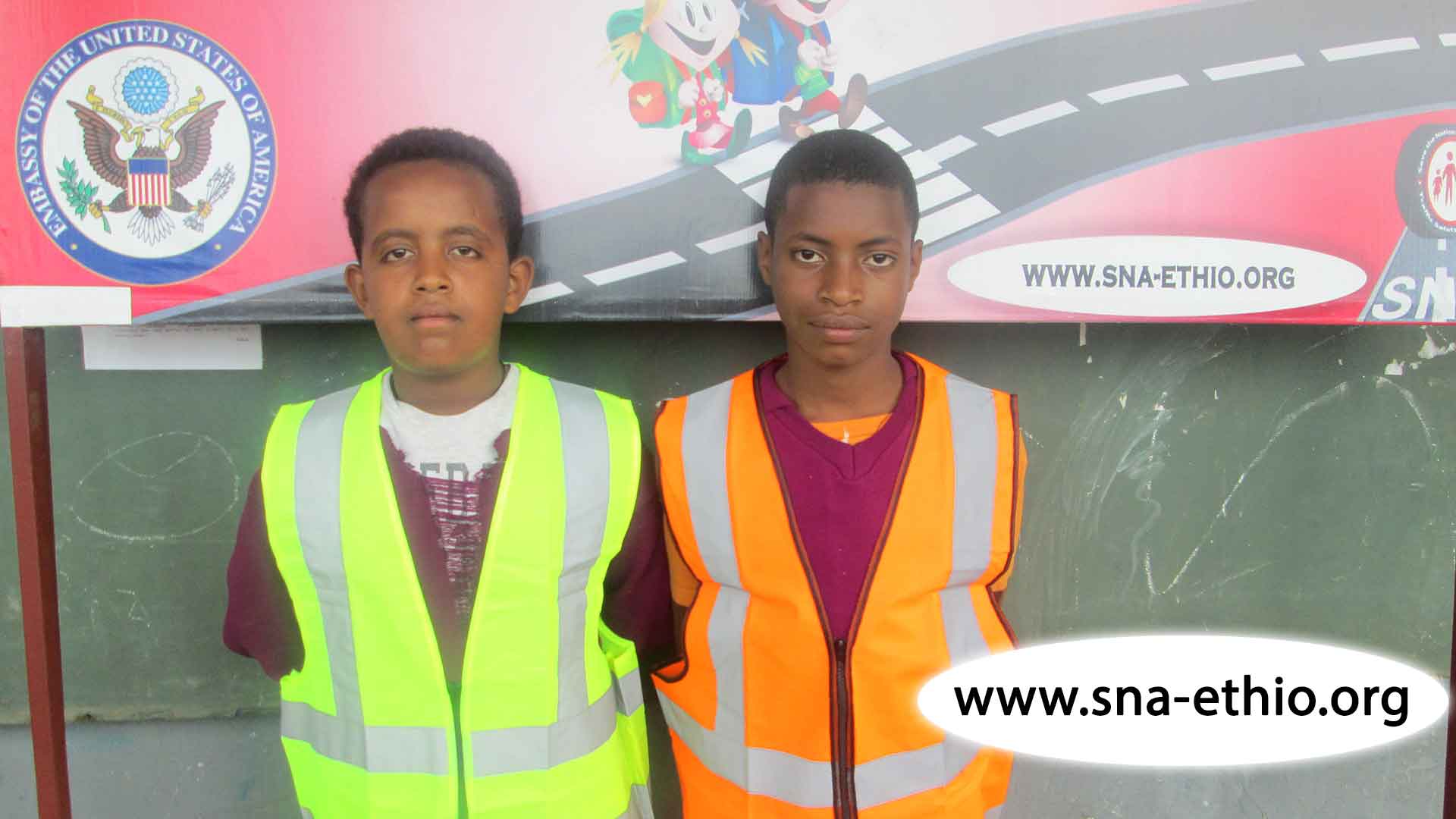 Students wearing reflector vests distributed by Save the Nation
