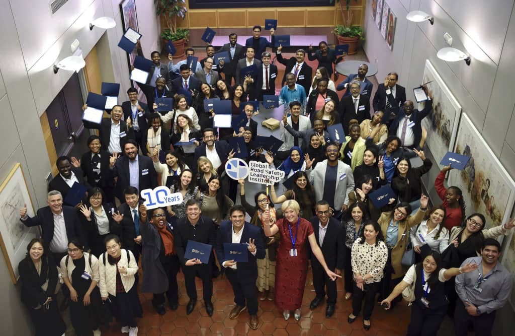 The full 8th Global Road Safety Leadership Course cohort celebrating with their certificates
